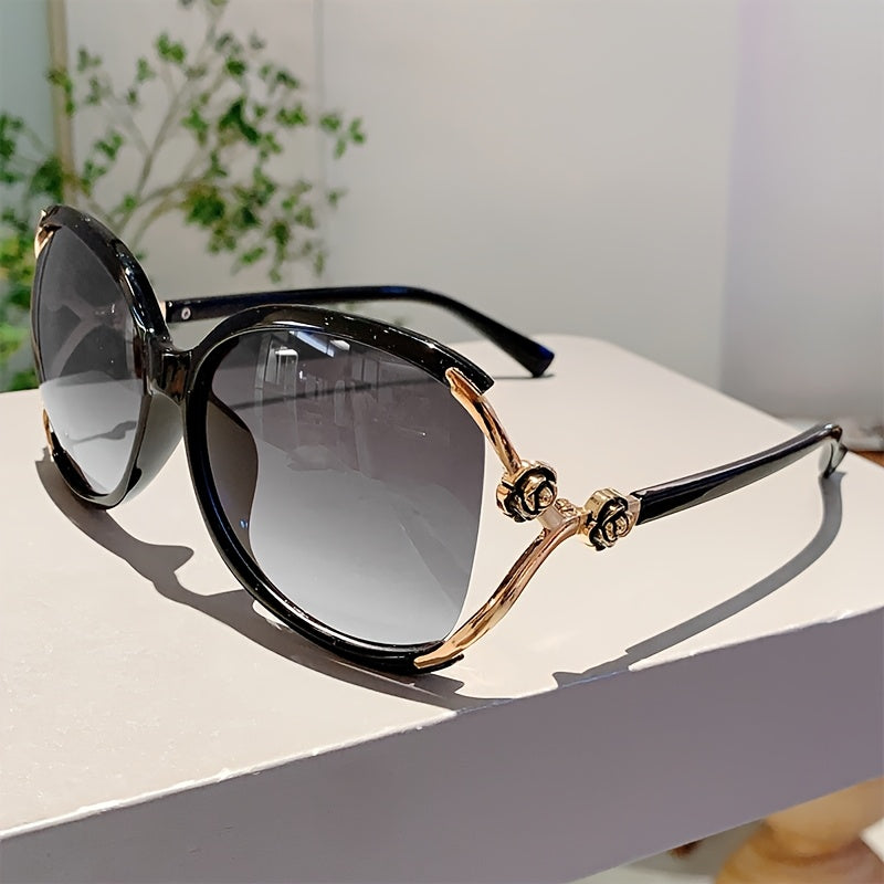 Women's oversized gradient sunglasses with unique rose detail, black acetate frame, UV400 protection.