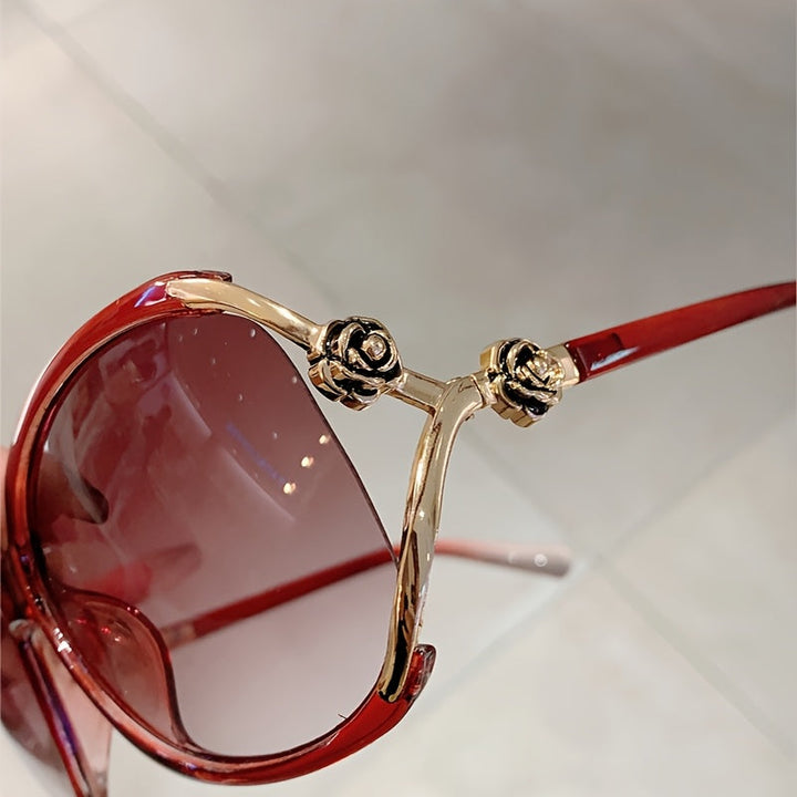 Stylish women's oversized eyewear, gradient lenses, rose motif, UV400 and anti-glare features.