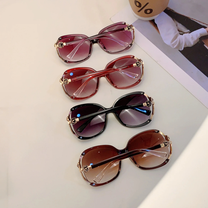 Modern brown oversized gradient women's sunglasses, rose detail, essential fashion accessory.