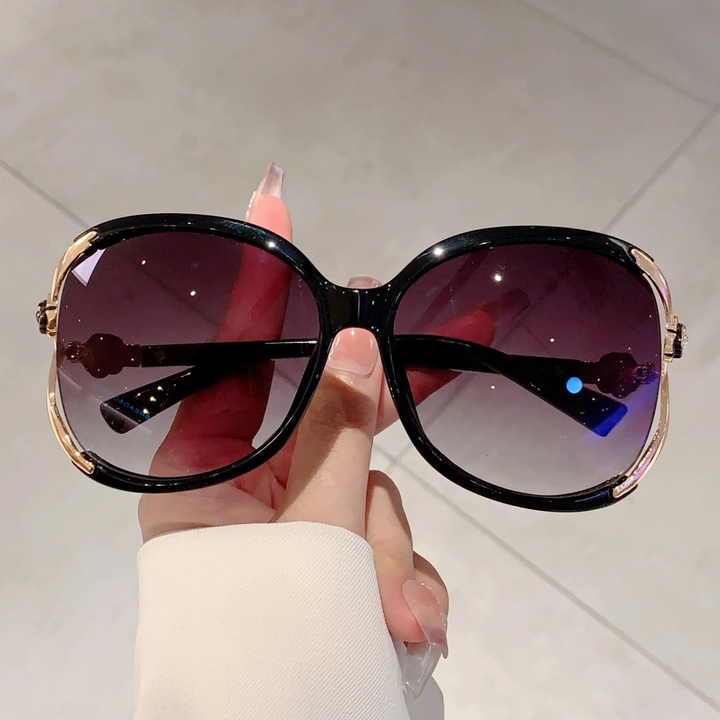 Chic women's oversized sunglasses, gradient lenses, glamorous rose detail, anti-glare UV400 protection.