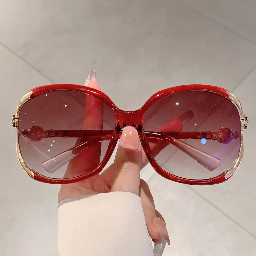 Black acetate oversized gradient sunglasses for women, chic rose detail, UV400 protection.