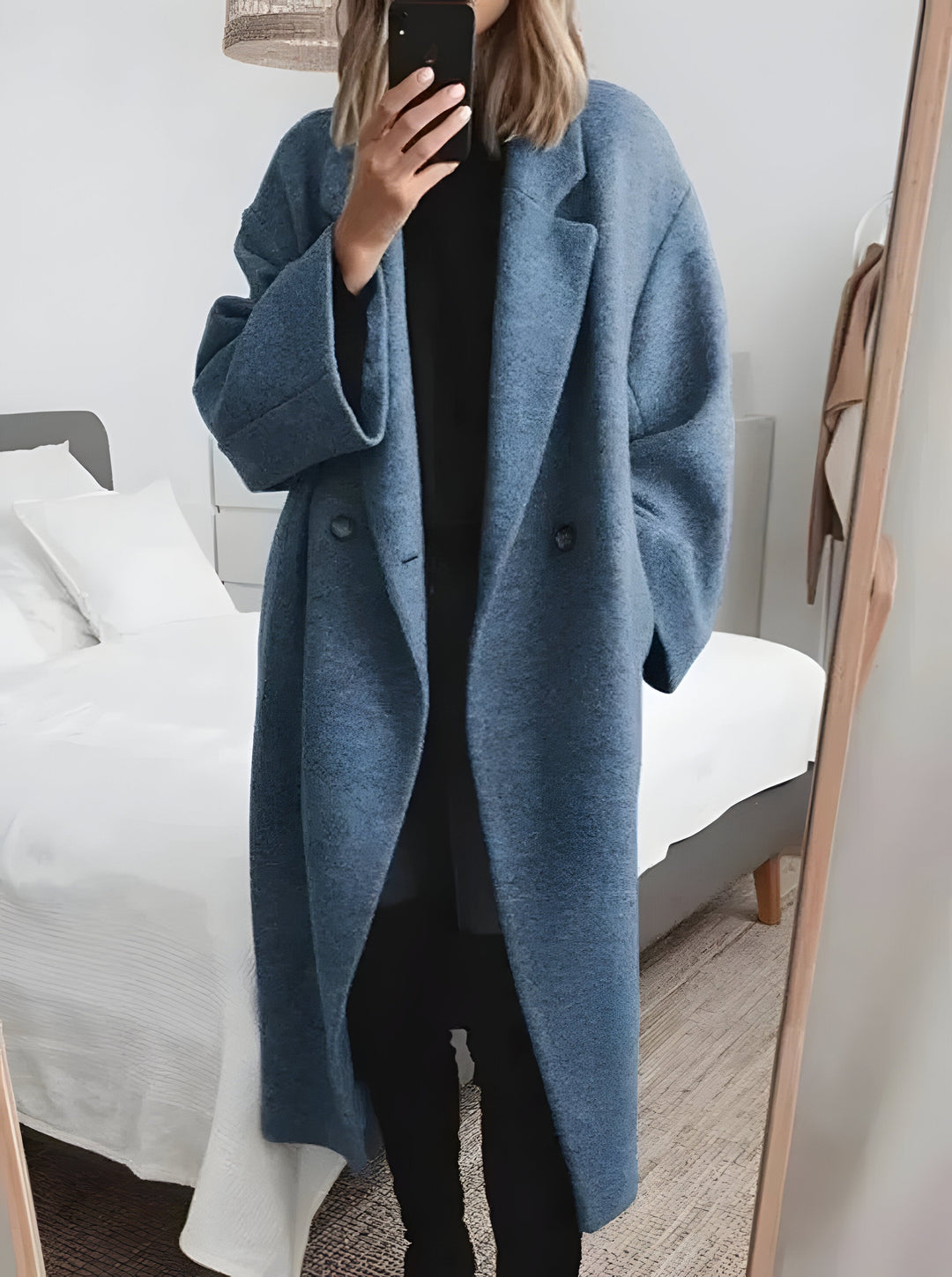 Chic women's oversized winter coat with a stylish lapel collar, offering a relaxed fit for versatile cold weather wear.