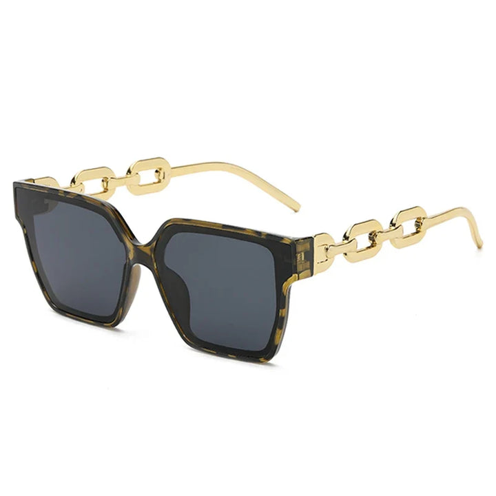 Elegant women's oversized sunglasses featuring unique chain link arms & a durable metal frame. UV400 eye protection.