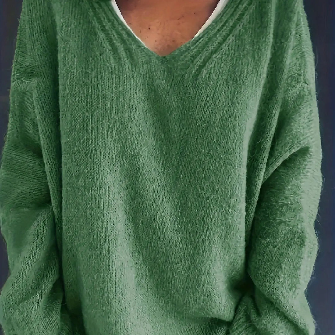 Comfortable women's oversized V-neck sweater, plus size fit. Ideal for fall & winter warmth.