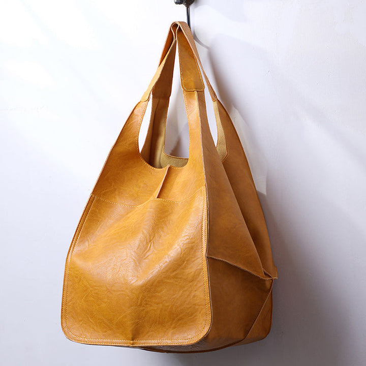 Sturdy fabric women's oversized weekend bag, a durable travel companion.