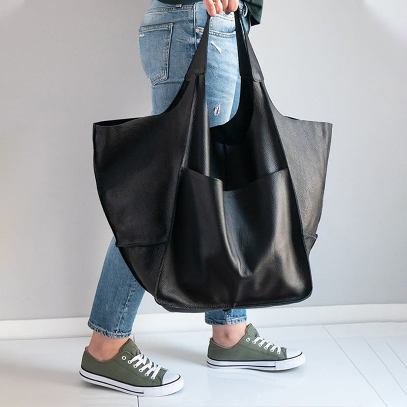 Secure zipper closure on a women's oversized travel bag for essentials.
