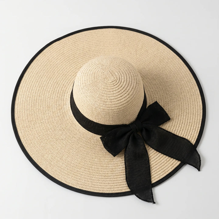 Neutral women's floppy wide brim sun hat, great for summer, beach, travel, and stylish sun protection.