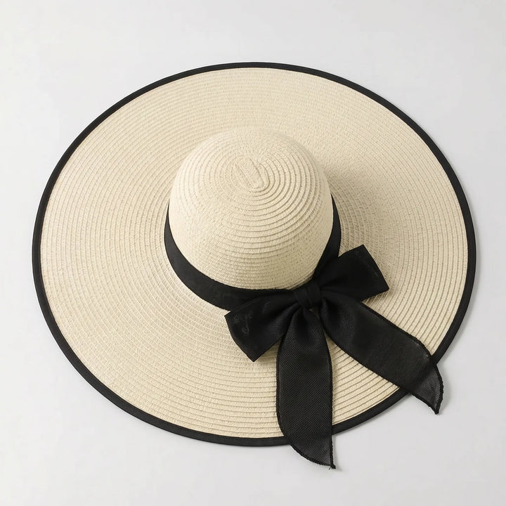 Women's oversized wide brim sun hat, a must-have for ultimate sun protection during summer vacations & resort trips.