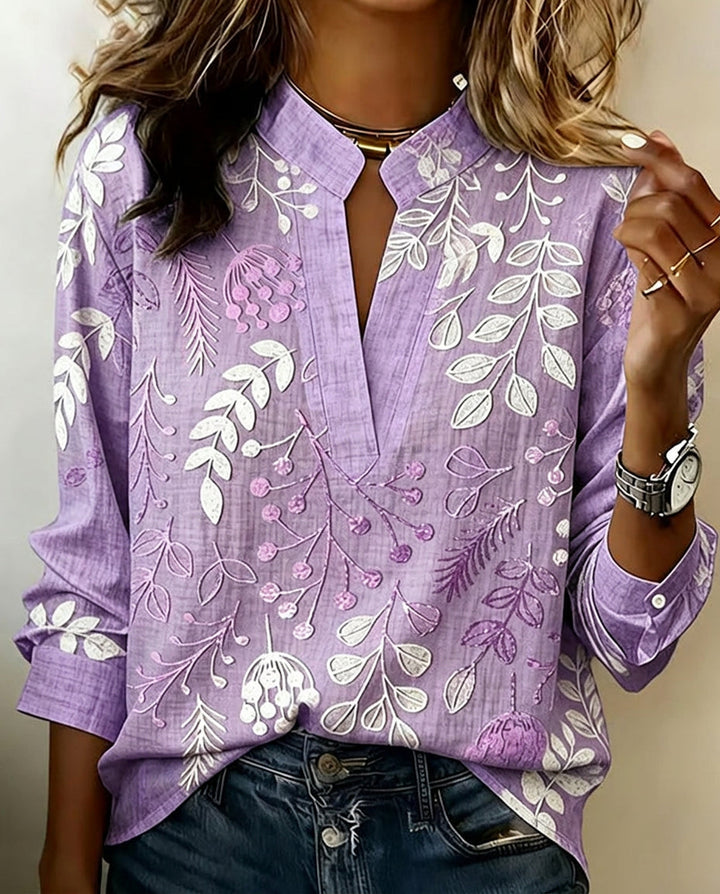 Women's pastel floral V-neck blouse, ideal for spring & summer casual wear. Lightweight & chic.