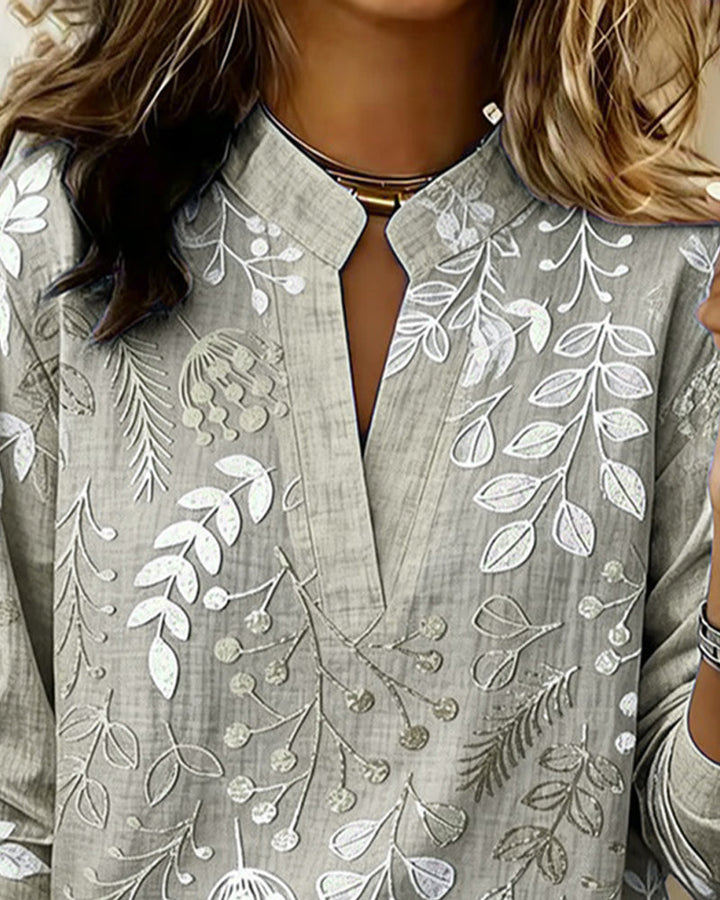 Summer fashion women's V-neck blouse in a vibrant pastel floral design, lightweight & airy fabric.