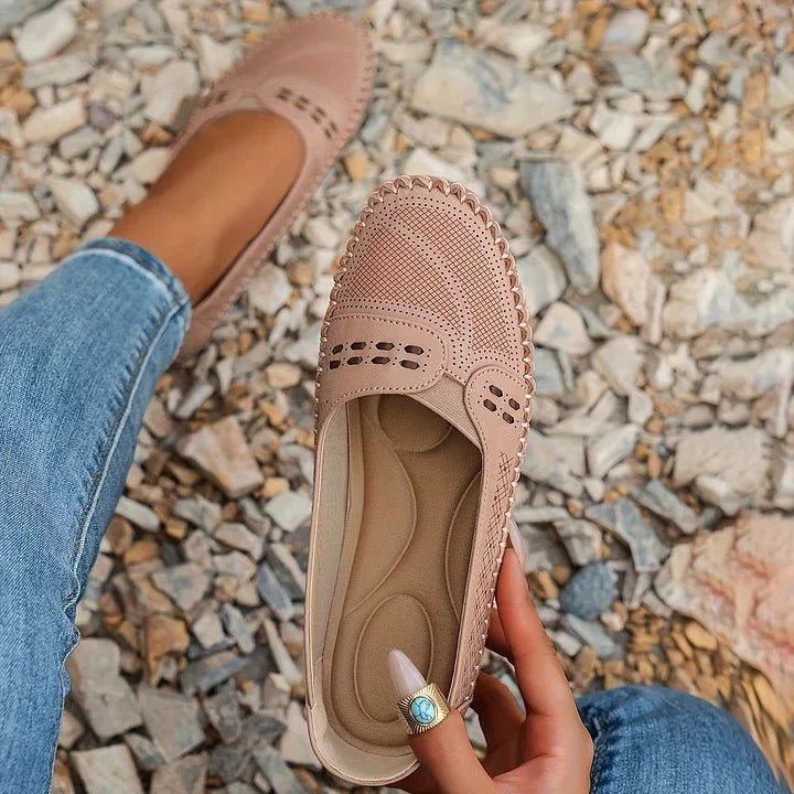 Classic women's perforated slip-on loafers, offering orthopedic support in a versatile design.