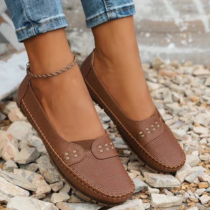 Versatile women's everyday slip-on loafers with perforated detail and orthopedic support.
