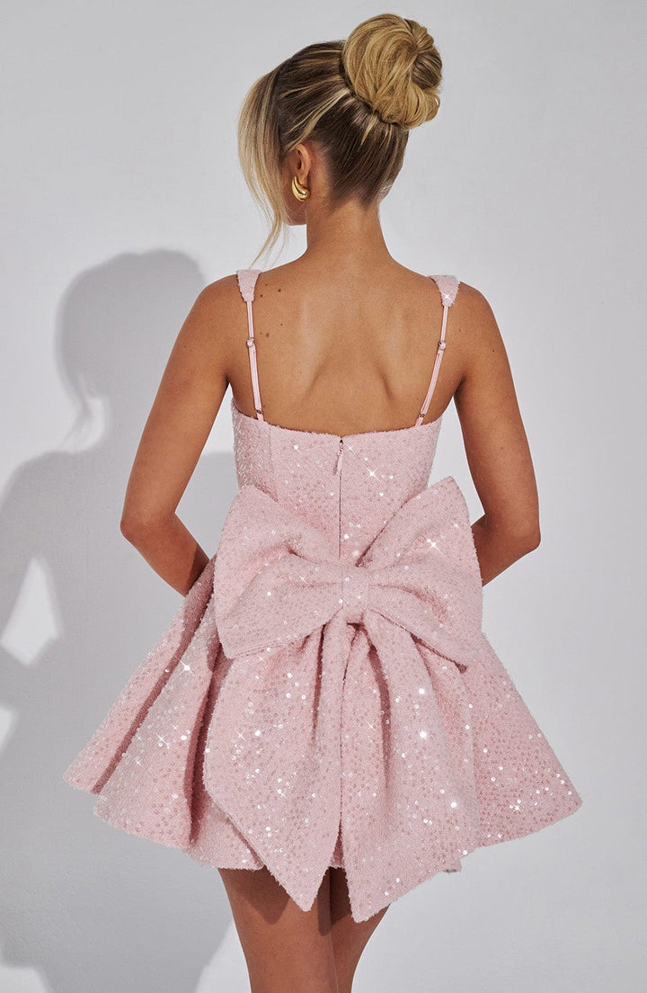 Flared white sequin party dress for women, featuring a chic bow, perfect for homecoming and dance events.