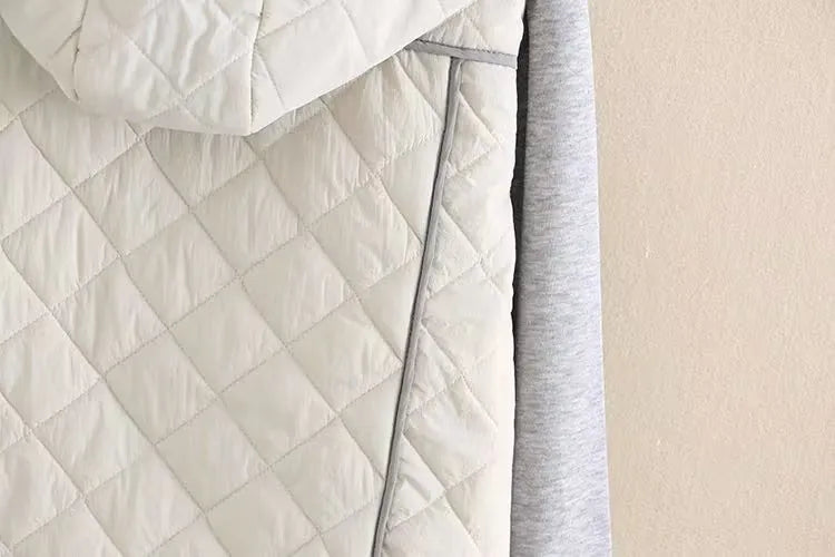 Oversized plus size women's hooded jacket, diamond quilted for comfort and cold weather protection.