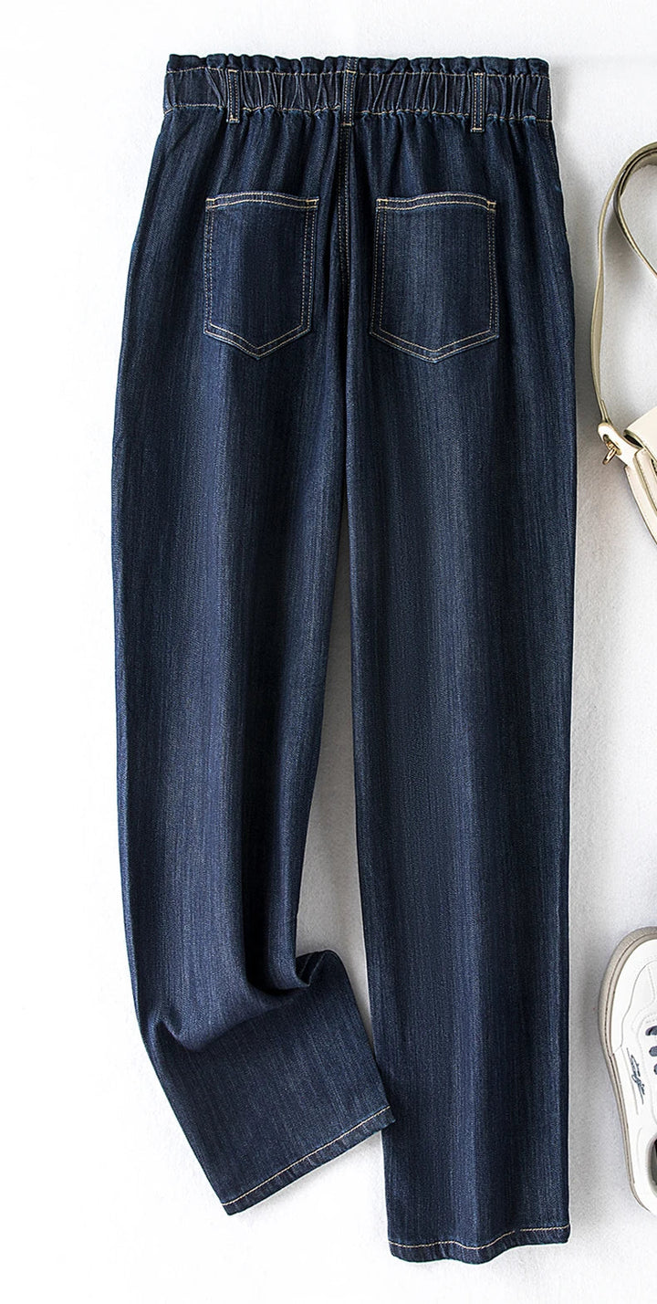 Relaxed fit plus size high-waist stretch mom jeans, essential for women's wardrobes.