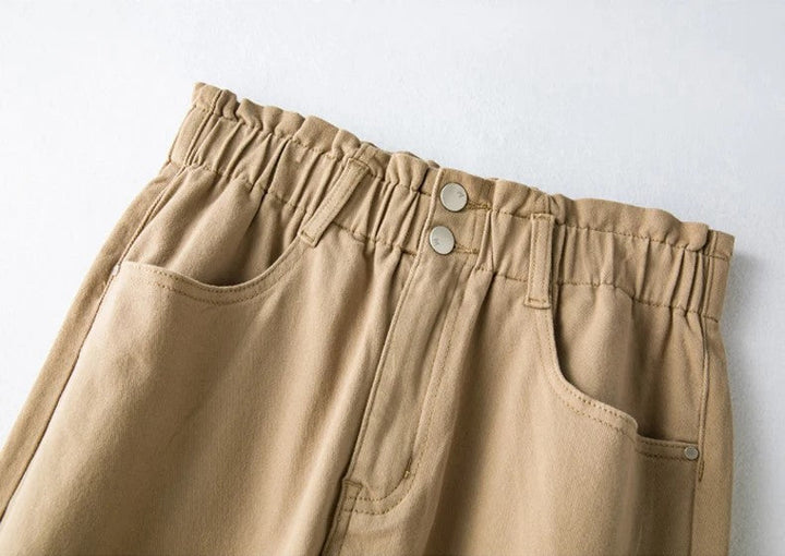 Contemporary plus size high-waist mom jeans, stretch fabric for a flattering shape.