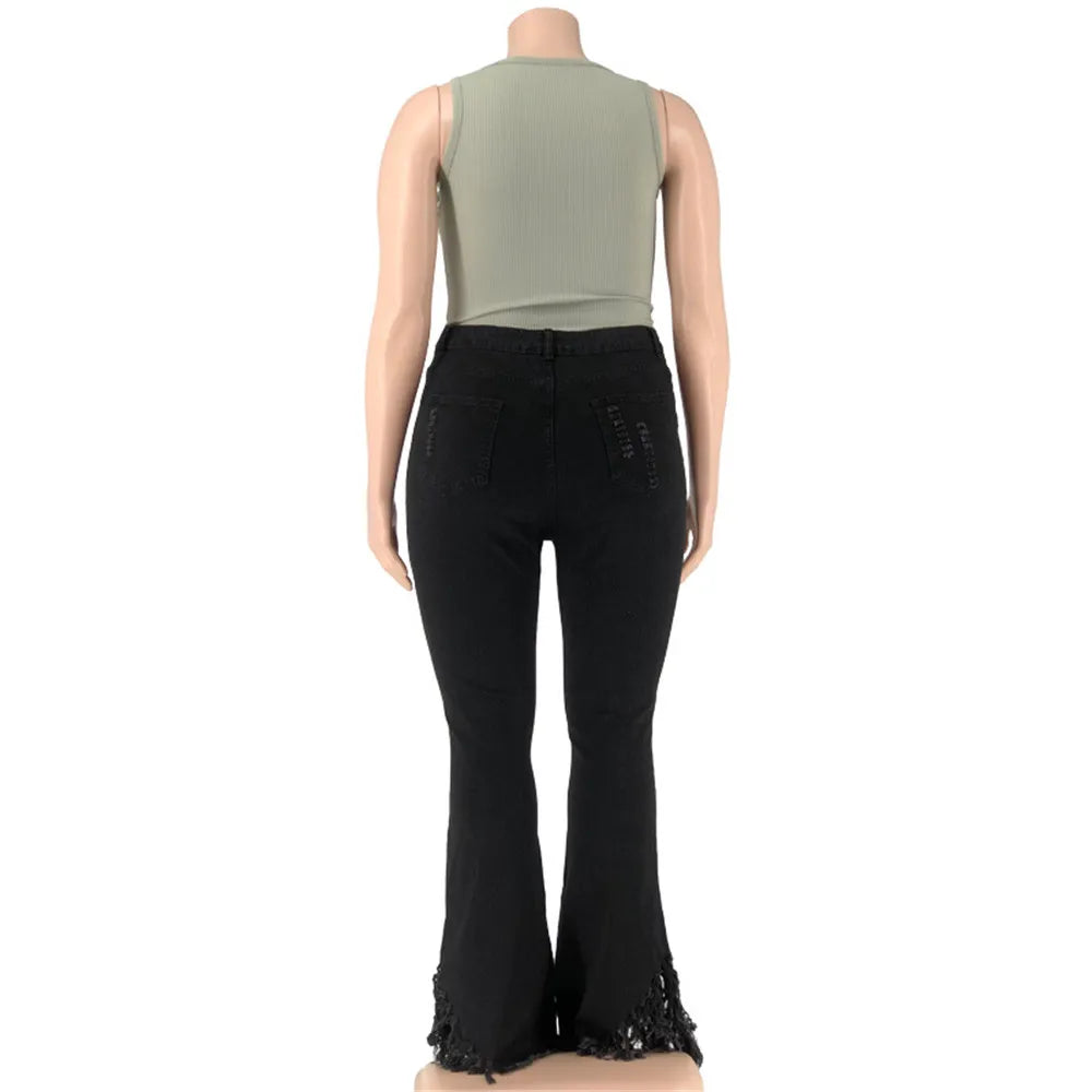 Women's plus size flared jeans, high-waisted with stylish rips, made from soft stretch denim.