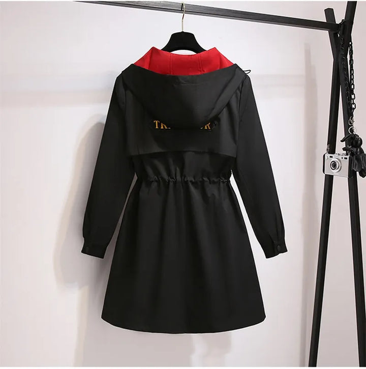 Oversized hooded windbreaker for plus size women, great for unpredictable transitional weather.