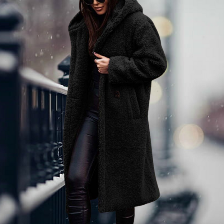 Cozy women's hooded plush winter coat, offering warmth and style for chilly days and nights.
