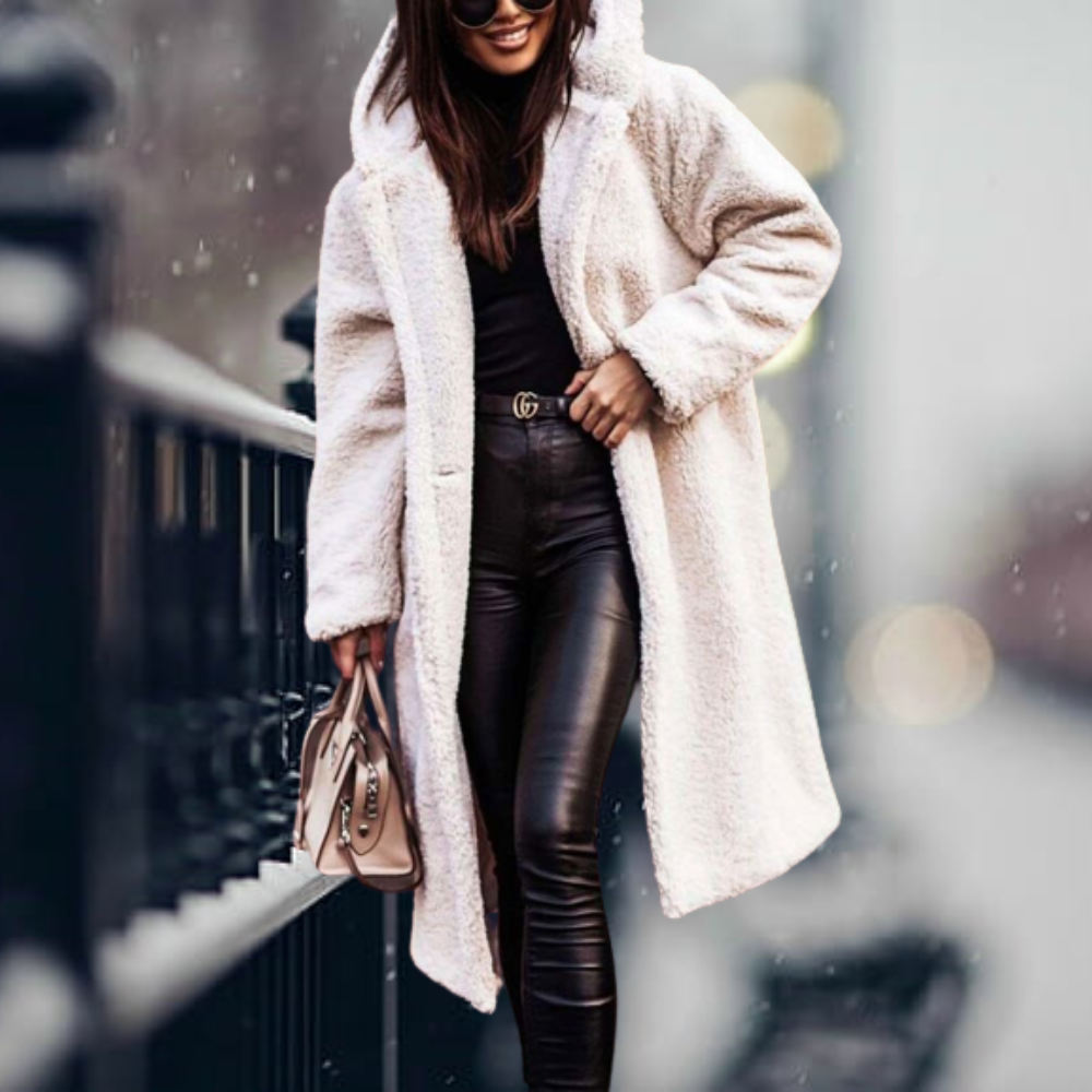 Soft plush women's hooded winter jacket, a warm outerwear essential for cozy winter fashion.