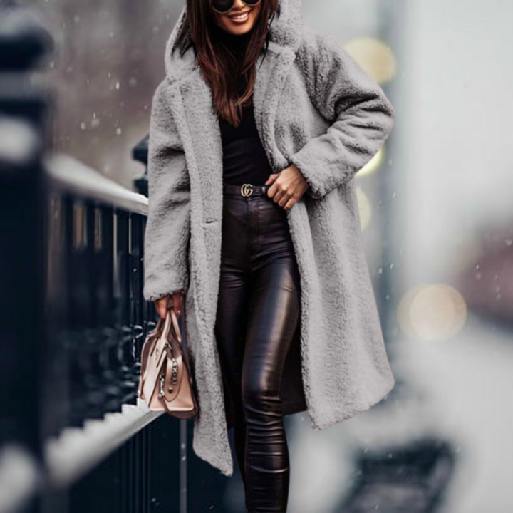 Women's long-sleeve hooded plush coat, an essential piece of warm winter outerwear for snowy days.