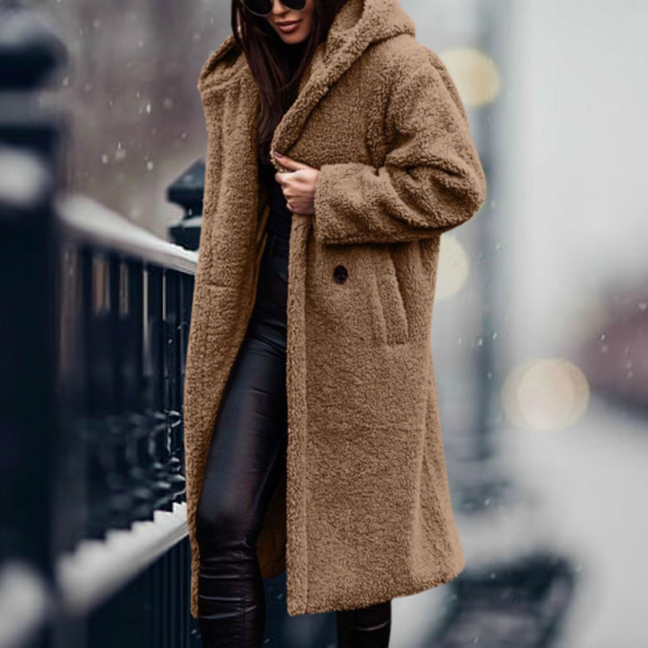 Front view of a women's plush hooded winter coat, showcasing its cozy fabric and elegant design.