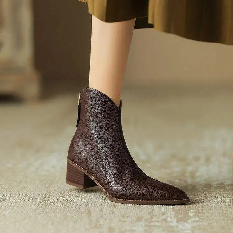 Women's pointed toe ankle boots with low heel, slip-on design. Perfect for office & everyday wear.