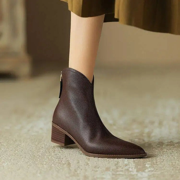 Women's pointed toe ankle boots with low heel, slip-on design. Perfect for office & everyday wear.