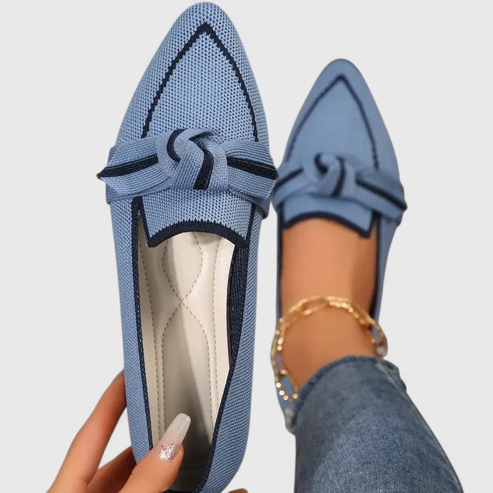 Women's pointed toe slip-on loafers featuring a stylish contrast trim. Ideal for casual or elegant wear.