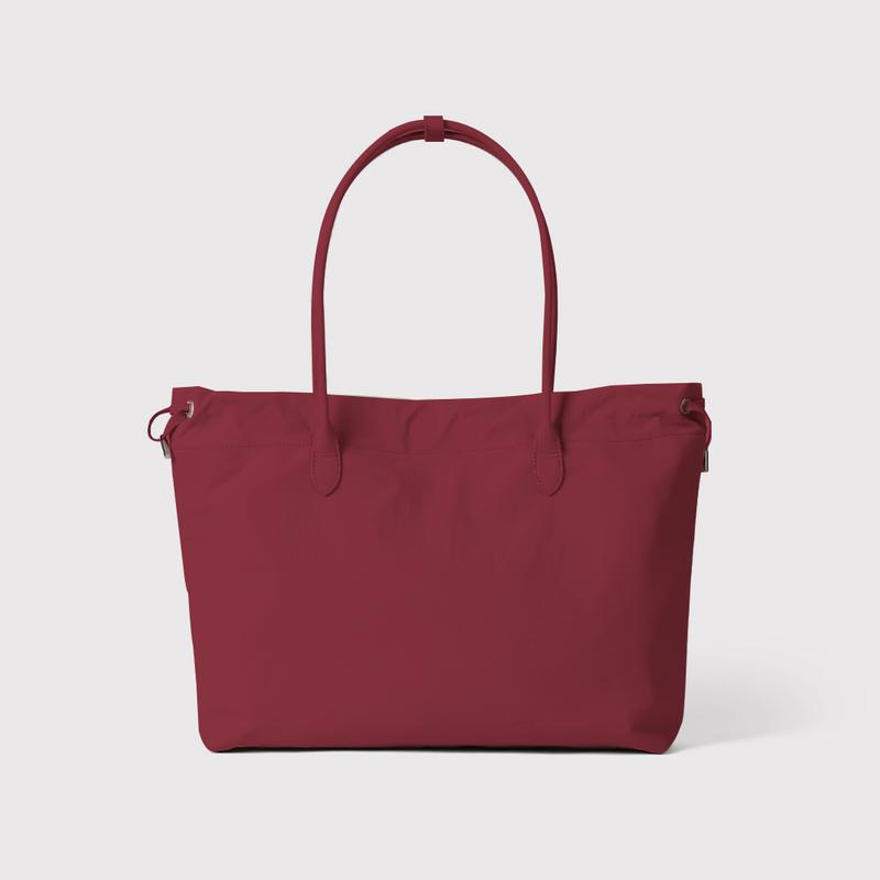 Elegant red leather tote bag for women, spacious work accessory, premium quality everyday carryall.
