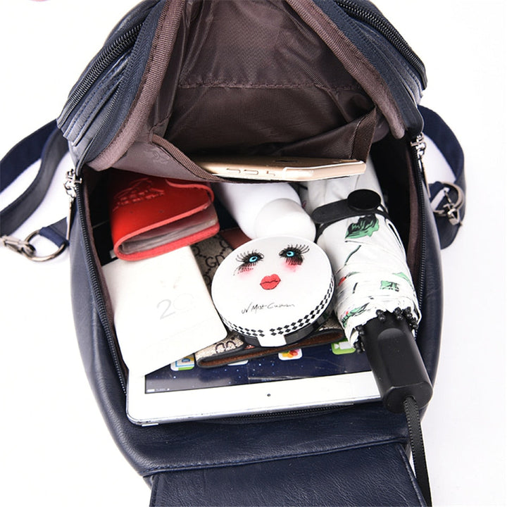 Practical water-resistant leather travel bag for women, with secure anti-theft features.