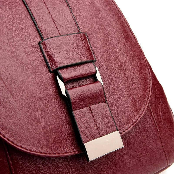 Woman wearing a water-resistant leather backpack, ideal for her daily commute.