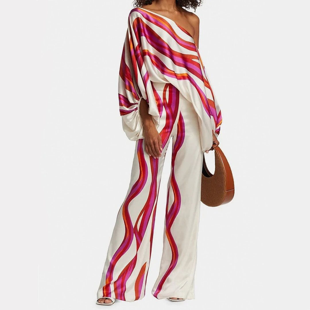 Women's printed one-shoulder top & wide-leg pants co-ord set. Stylish two-piece for summer vacation.