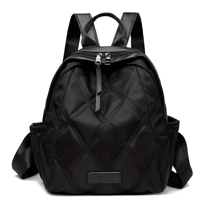 Functional women's quilted backpack, easily converts from a travel pack to a stylish shoulder bag.