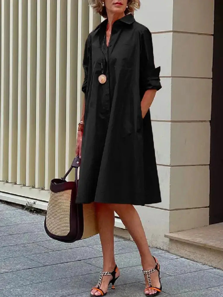 Women's relaxed A-line button-front midi shirt dress, long sleeve, perfect for casual or elegant wear.
