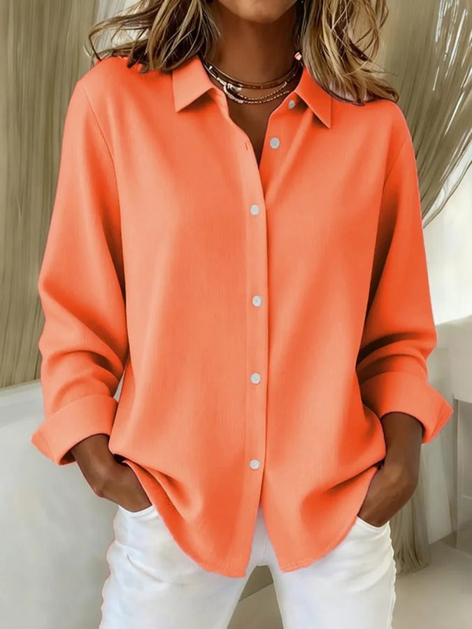 Plus size women's relaxed fit long sleeve blouse, a comfortable button-down top for work or casual wear.