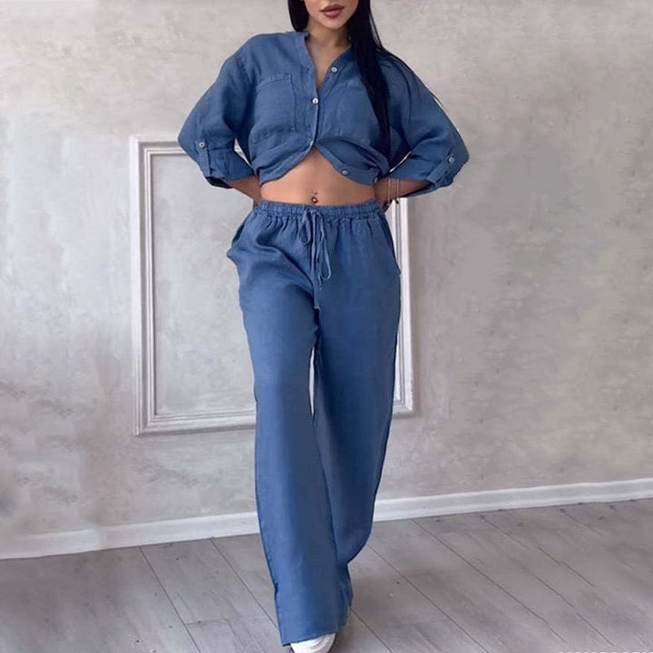 Stylish women's lounge wear set featuring a relaxed button-down shirt and comfortable wide-leg pants.