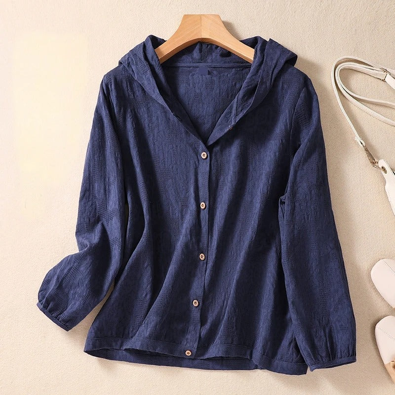 White women's relaxed fit hooded shirt. Pullover top, comfortable for casual wear and everyday fashion.