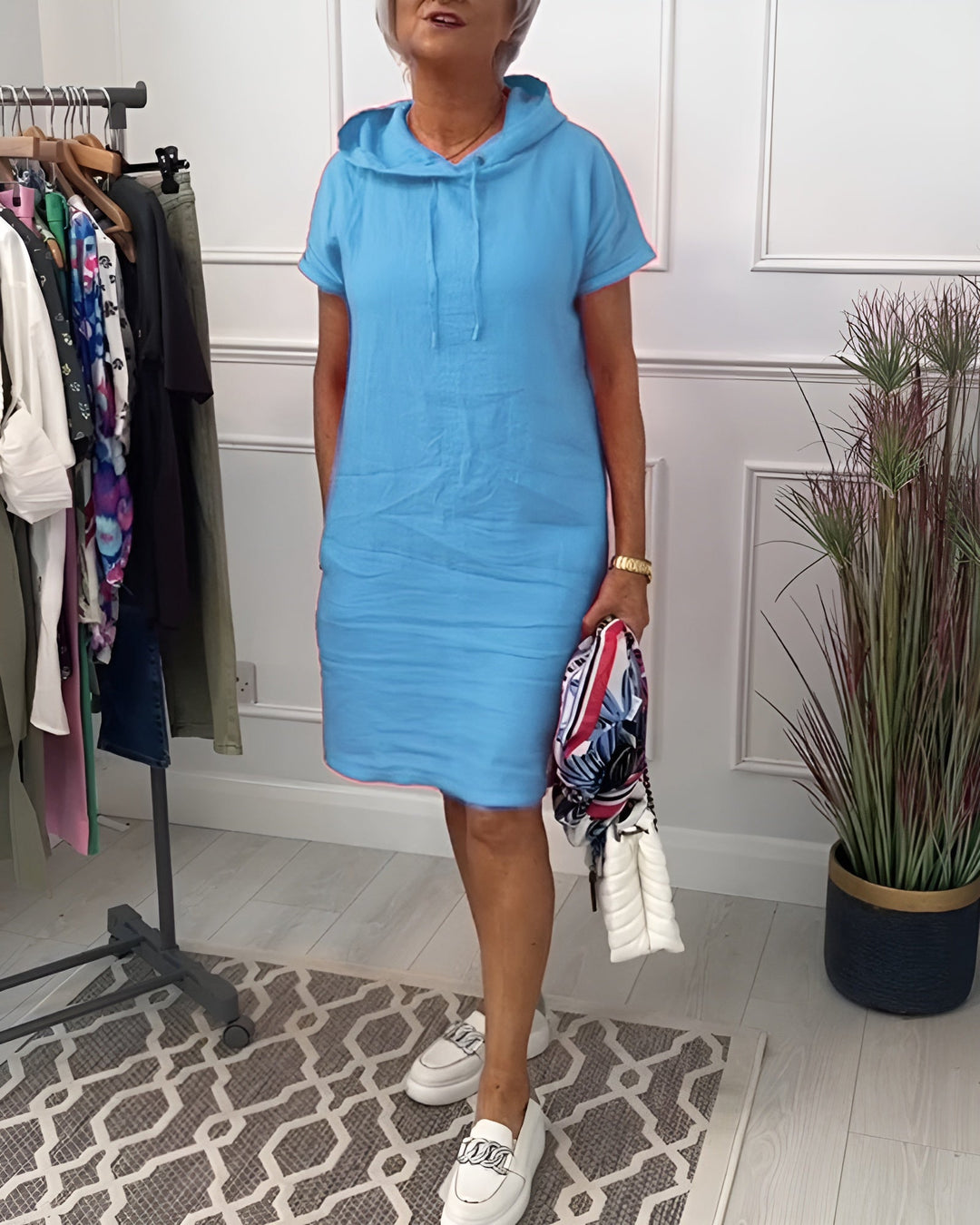 Women's casual relaxed fit midi dress, hoodie style, with an adjustable hood & half sleeves.
