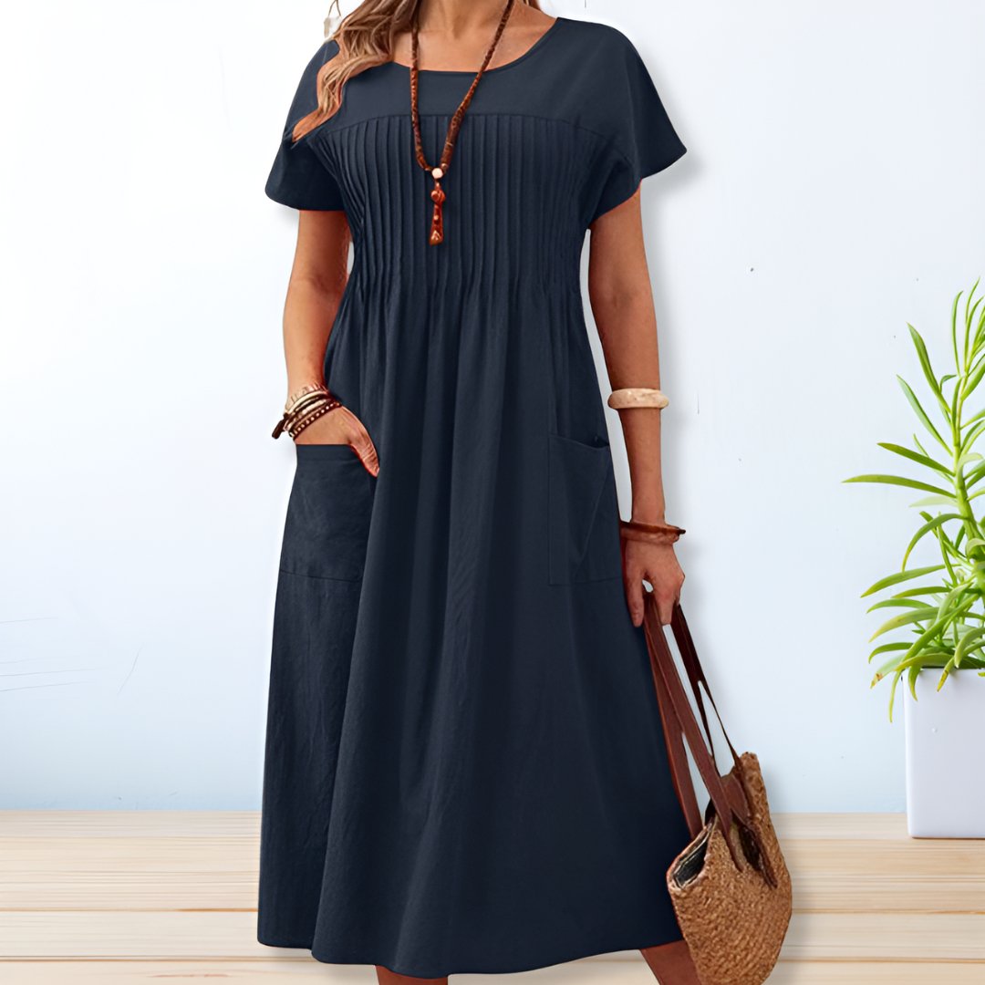 Comfortable women's short sleeve midi day dress with practical pockets, relaxed fit for everyday summer wear.