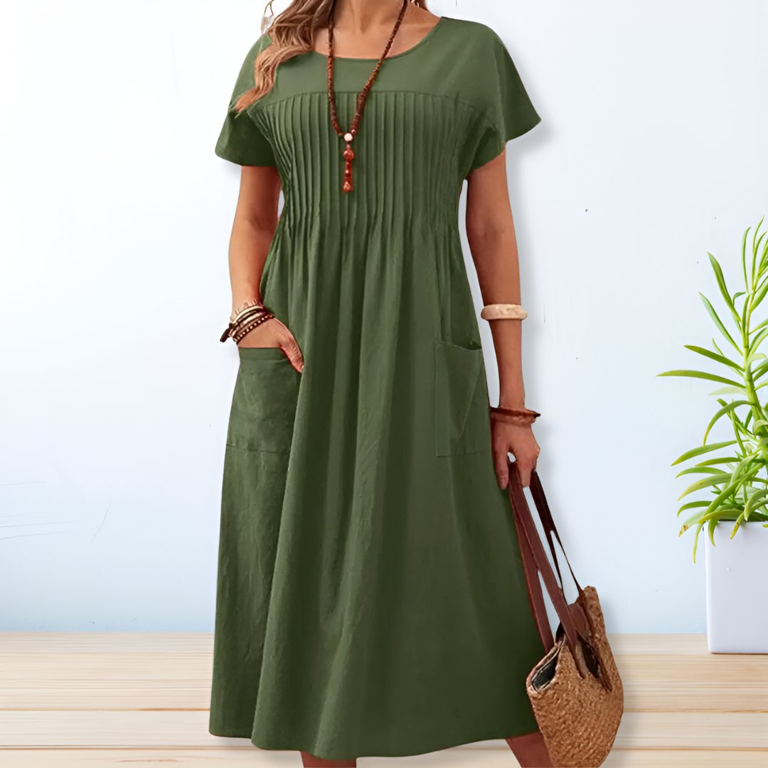 Comfortable women's midi day dress with a relaxed fit, short sleeves, and pockets for versatile everyday style.