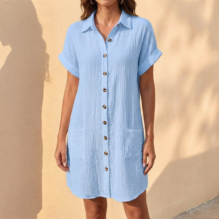 Versatile women's midi shirt dress with relaxed fit, button front, and cuffed sleeves. Ideal for everyday casual style.