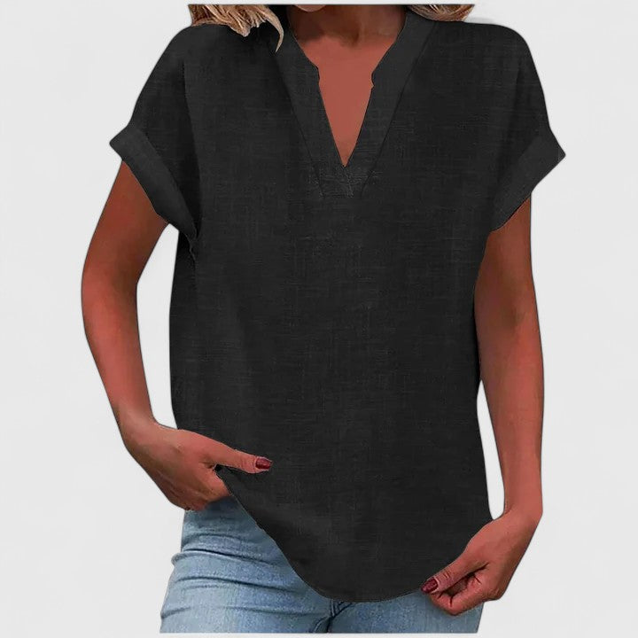 Versatile women's relaxed blouse featuring a stylish V-neck, comfortable fabric, and curved hem.