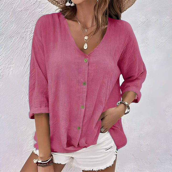 Elegant women's button-up V-neck blouse with roll tab sleeves, offering a relaxed fit for versatile everyday wear.