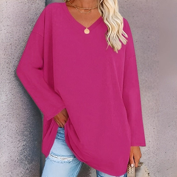Stylish women's V-neck shirt, relaxed fit. Chic long sleeve top for versatile casual or everyday fashion.