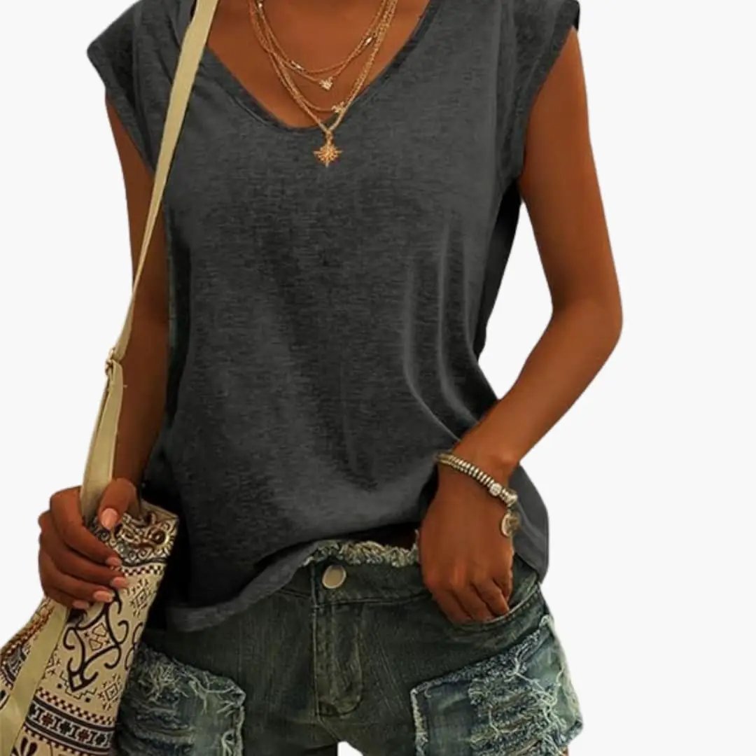 Casual women's sleeveless V-neck top, paired with jeans for an effortless everyday summer outfit.