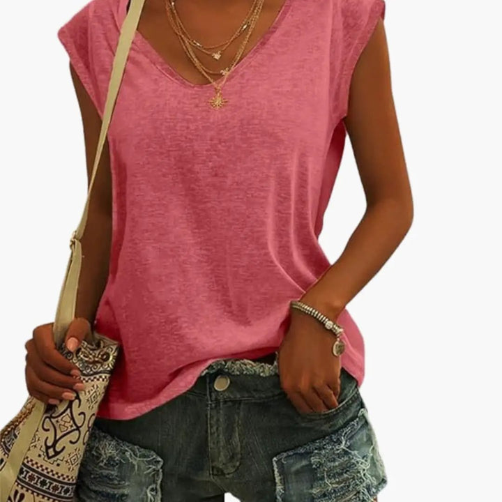 Women's relaxed V-neck sleeveless top in blue, with a flowing drape for comfortable all-day wear.