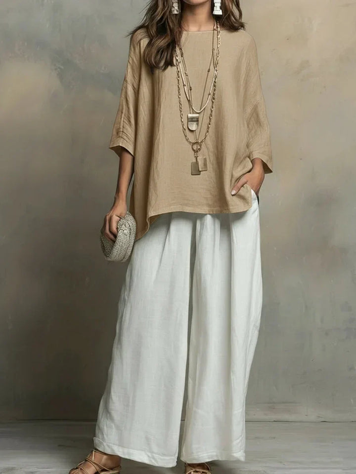 Stylish women's two-piece relaxed fit shirt and wide-leg pants set, ideal for comfortable vacation fashion.