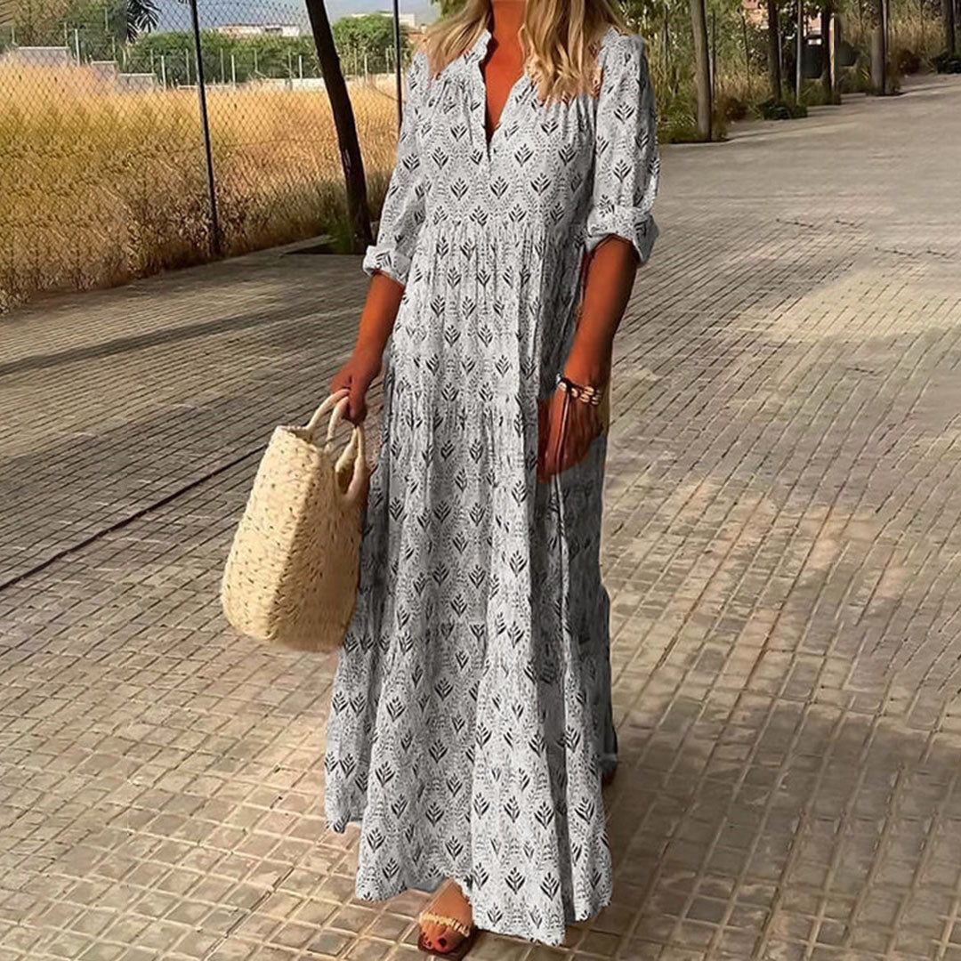 Casual women's summer maxi dress featuring a relaxed V-neck, eye-catching boho print, and comfortable long sleeves.