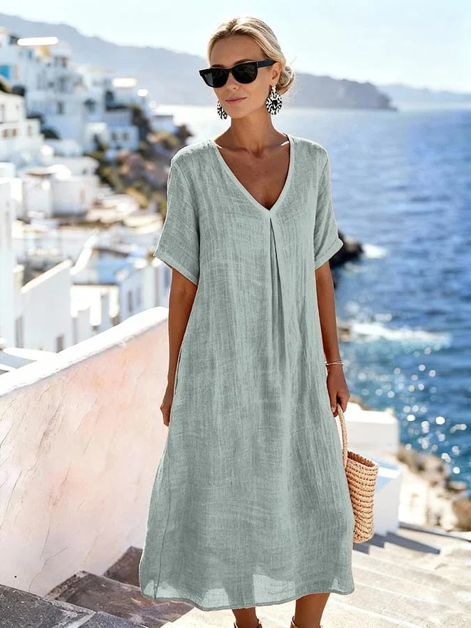 Women's summer midi dress, relaxed v-neck, short sleeves, casual flowing fit, vacation style.